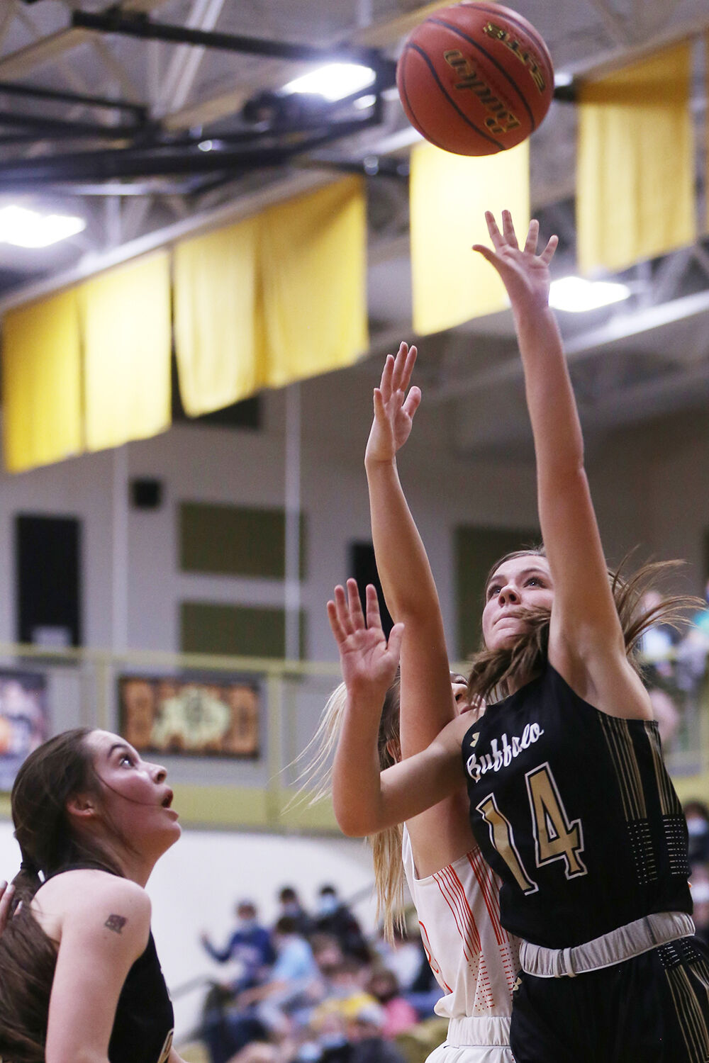 Tess Rule jumps for two after rebounding the ball